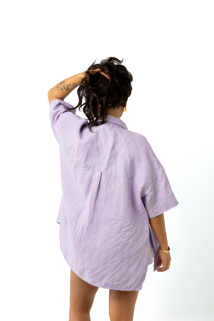 model wears size 6/8 linen shirt and shorts set in lilac