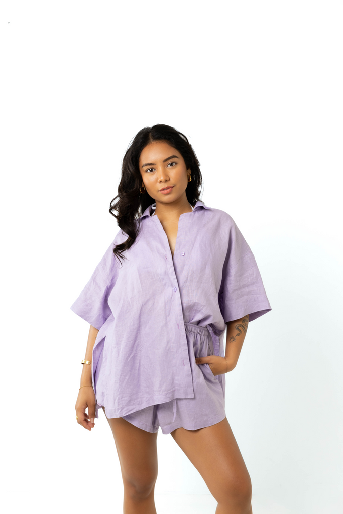 model wears size 6/8 linen shirt and shorts set in lilac 