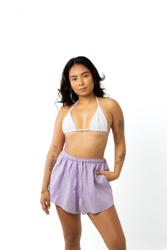 model wears size 6/8 linen shirt and shorts set in lilac